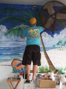 Lloyd Dobson Artist painting Monk's Steamer Bar patio mural