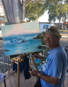 Lloyd Dobson Artist painting an ocean scene at Monk's Steamer Bar in Gulf Gate Florida