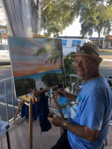 Lloyd Dobson Artist painting a beach scene oil painting